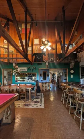 a view of a chairs and table in the patio