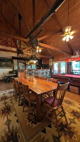 a outdoor patio with table and chairs