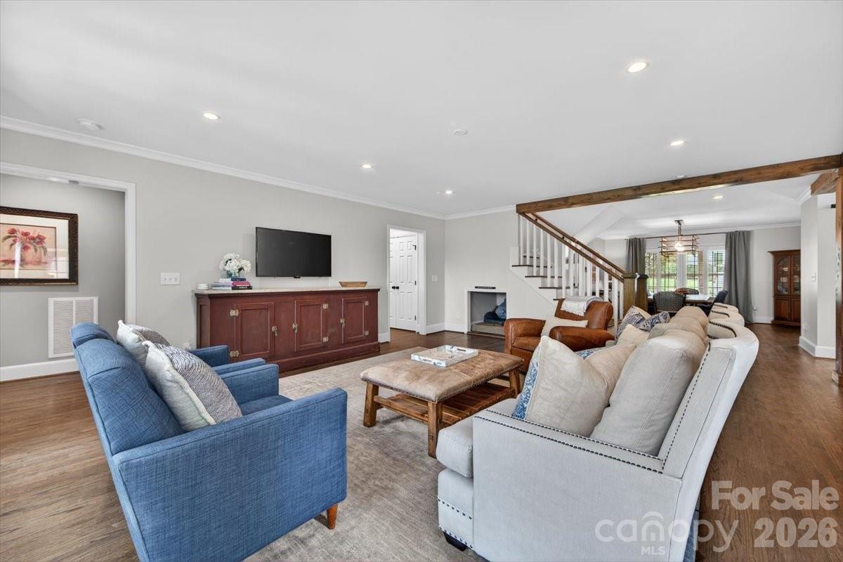 308 Robmont Road Charlotte, NC 28270 - Photo 16 of 43 a living room with furniture and a flat screen tv