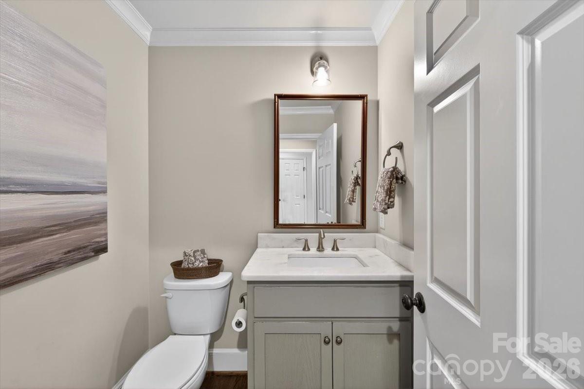 308 Robmont Road Charlotte, NC 28270 - Photo 18 of 43 a bathroom with a toilet sink and mirror