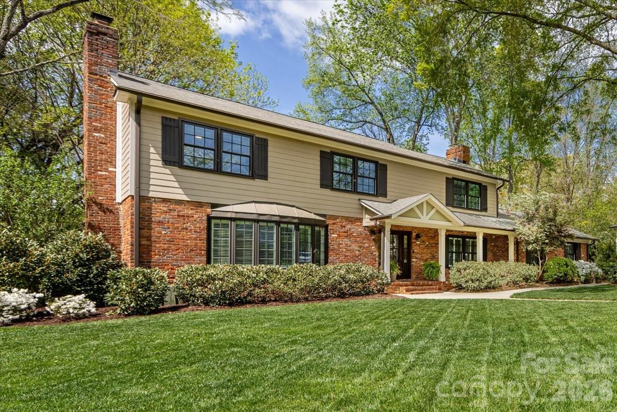 308 Robmont Road Charlotte, NC 28270 - Photo 2 of 43 a front view of a house with a yard