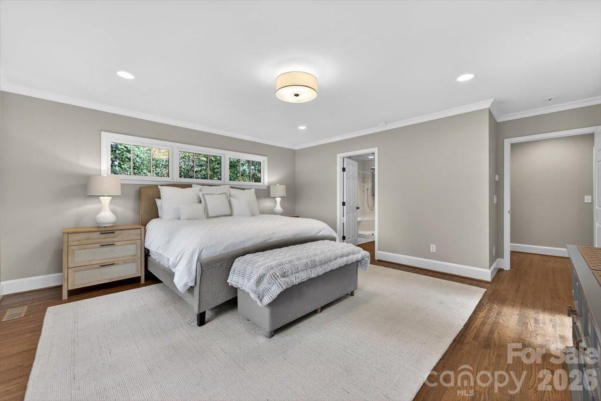 308 Robmont Road Charlotte, NC 28270 - Photo 21 of 43 a spacious bedroom with a bed and a window