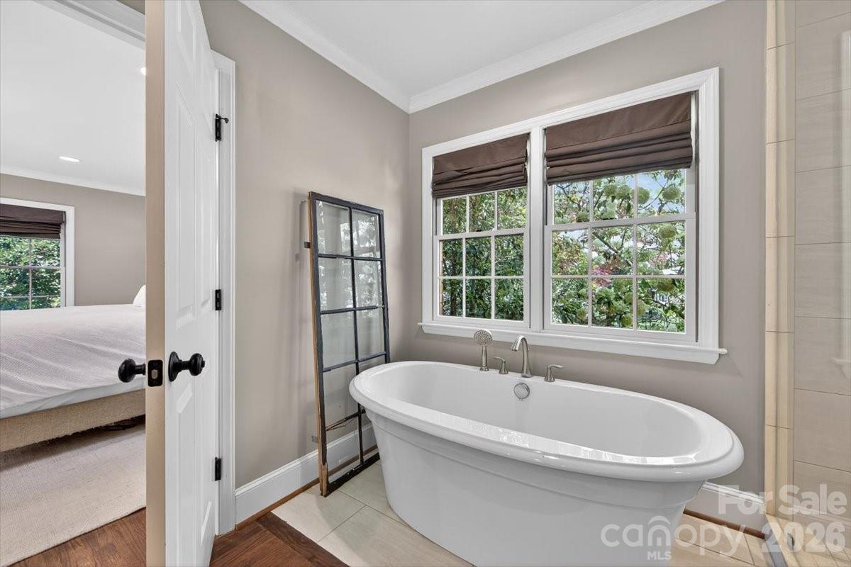 308 Robmont Road Charlotte, NC 28270 - Photo 24 of 43 a white bath tub sitting next to a window