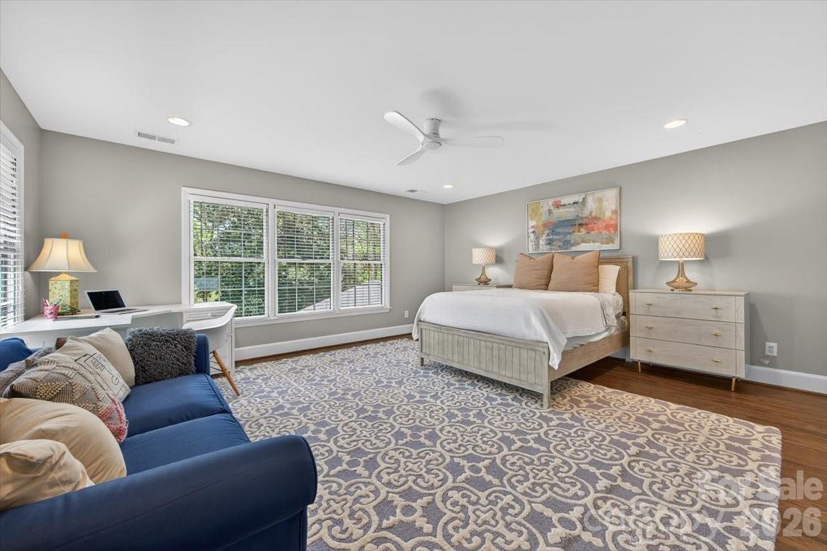 308 Robmont Road Charlotte, NC 28270 - Photo 27 of 43 a bedroom with a large bed and a couch