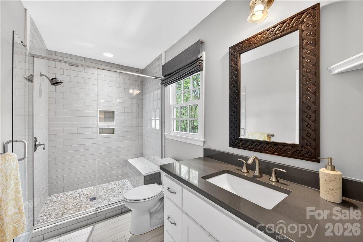 308 Robmont Road Charlotte, NC 28270 - Photo 28 of 43 a bathroom with a granite countertop sink toilet and shower