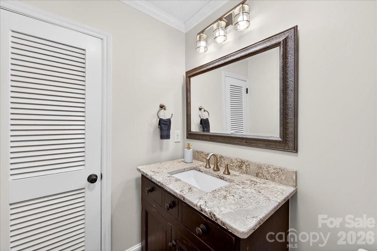 308 Robmont Road Charlotte, NC 28270 - Photo 34 of 43 a bathroom with a granite countertop sink and a mirror