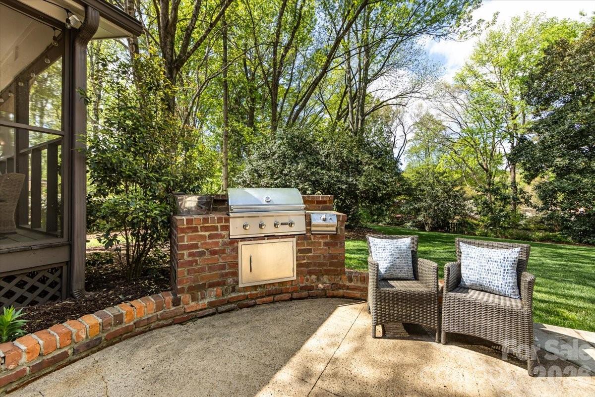 308 Robmont Road Charlotte, NC 28270 - Photo 39 of 43 a view of a chairs and fire pit in the back yard