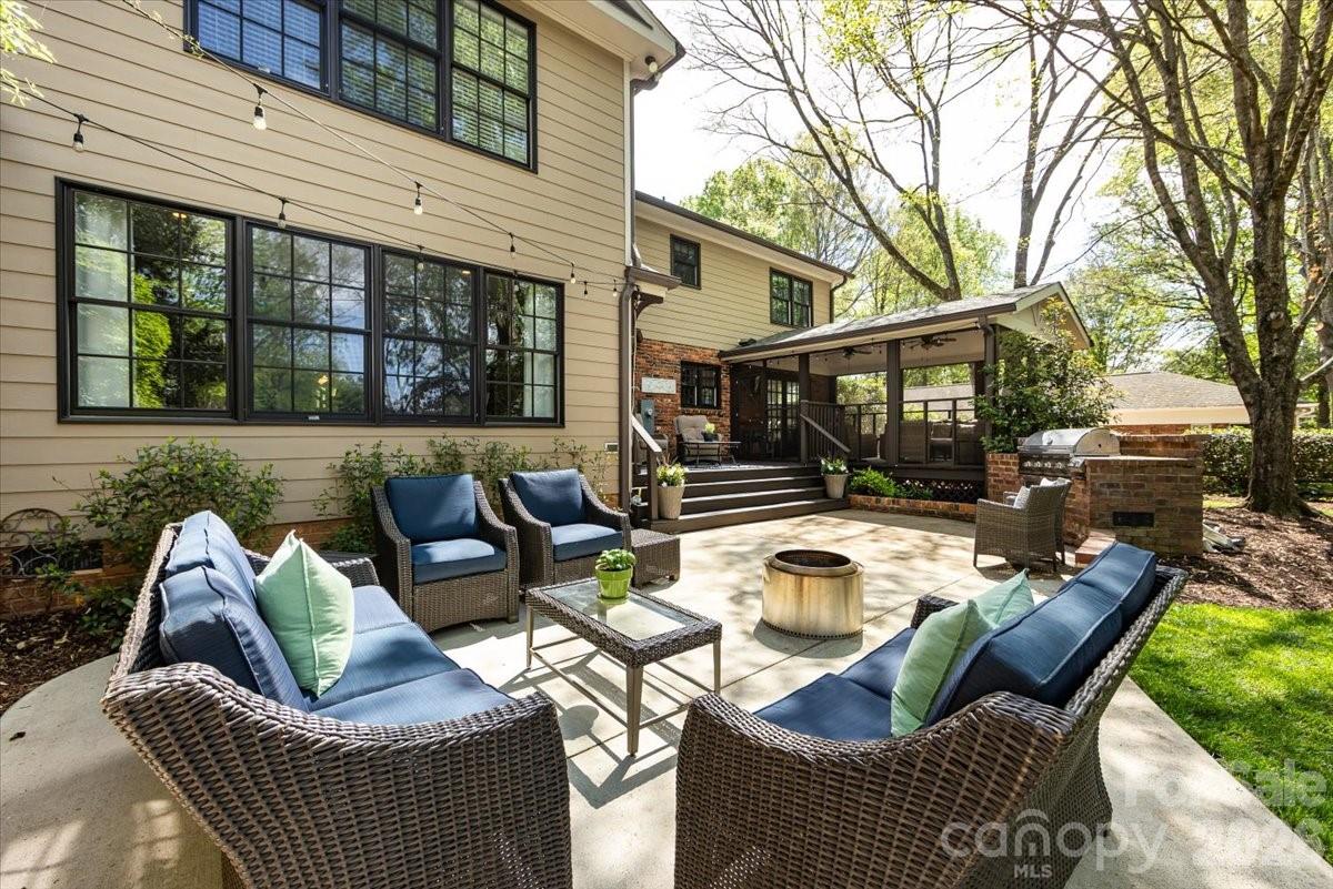 308 Robmont Road Charlotte, NC 28270 - Photo 40 of 43 a view of a patio with couches chairs and a fire pit