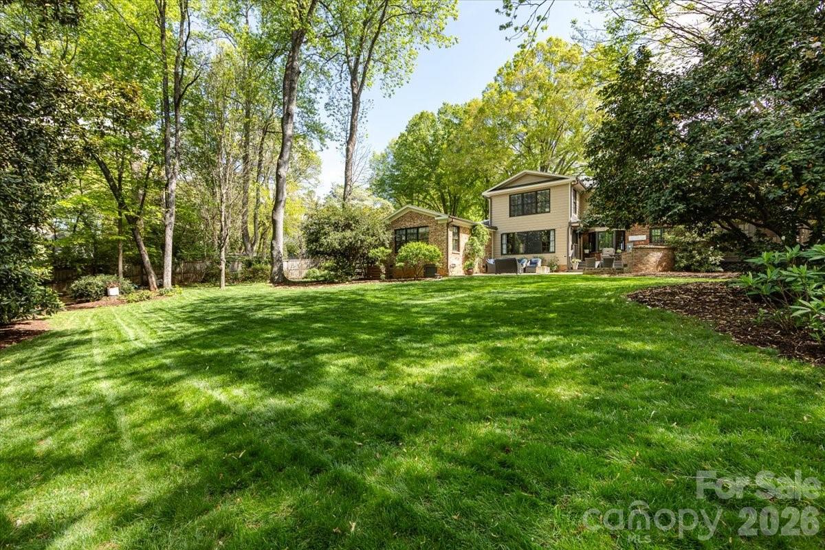 308 Robmont Road Charlotte, NC 28270 - Photo 41 of 43 a view of a house with a big yard and large trees