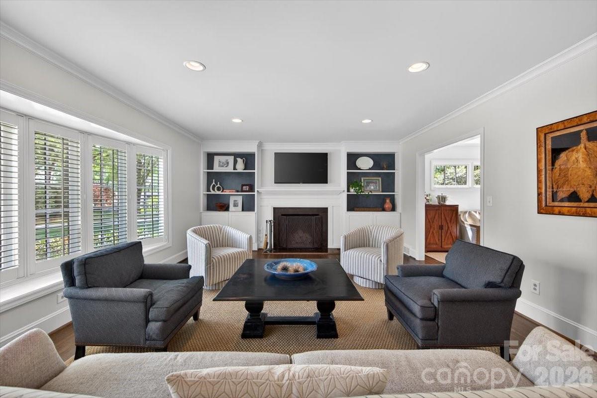308 Robmont Road Charlotte, NC 28270 - Photo 7 of 43 a living room with furniture large window and a fireplace
