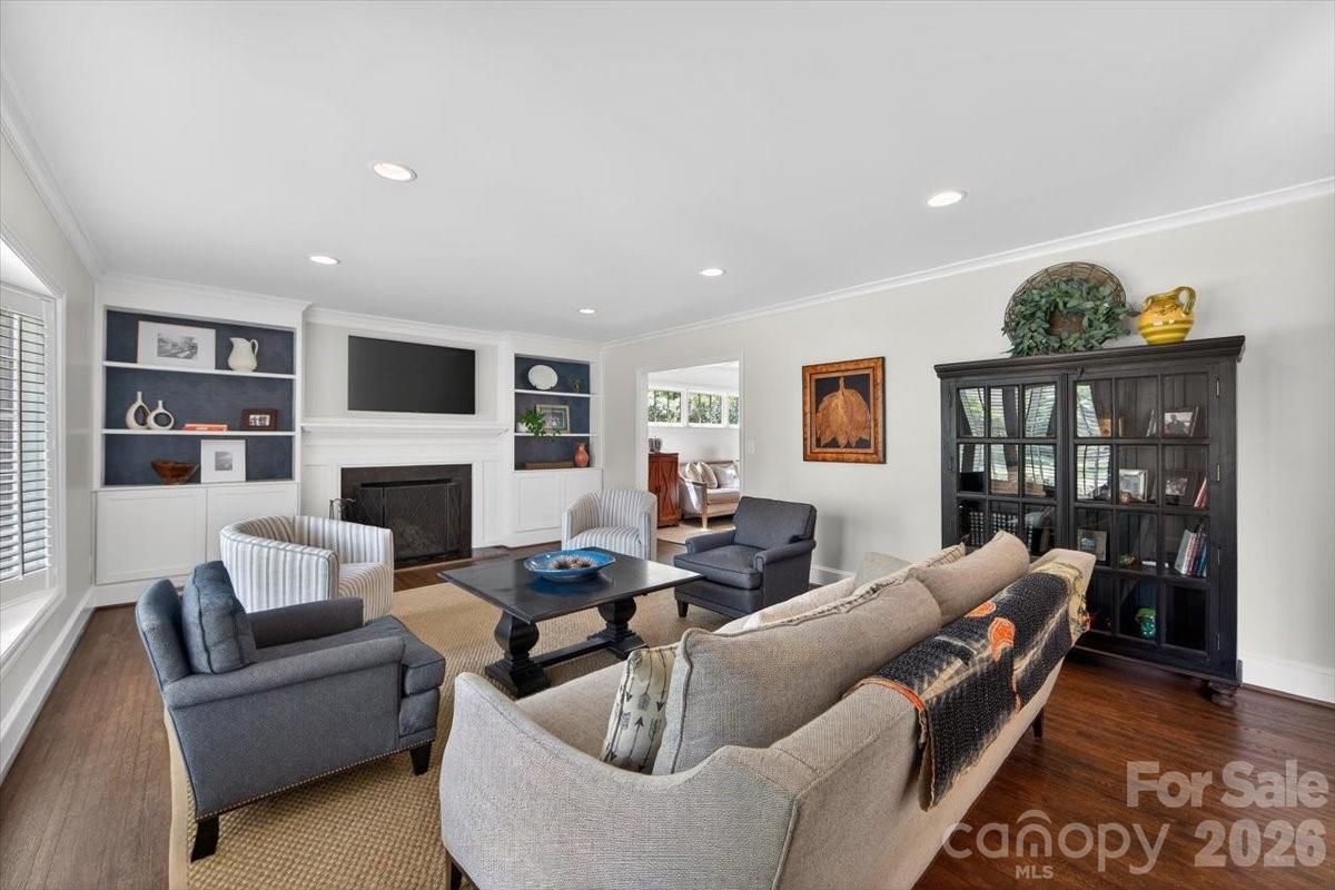 308 Robmont Road Charlotte, NC 28270 - Photo 8 of 43 a living room with furniture a fireplace and a flat screen tv