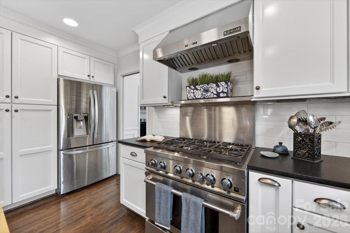 308 Robmont Road Charlotte, NC 28270 - Photo 10 of 43 a kitchen with granite countertop stainless steel appliances and wooden cabinets