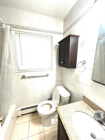 a bathroom with a bath tub with a shower