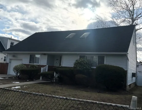 a front view of a house with garage