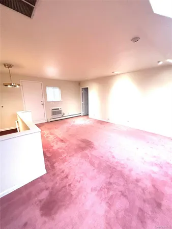 a view of a big room with windows