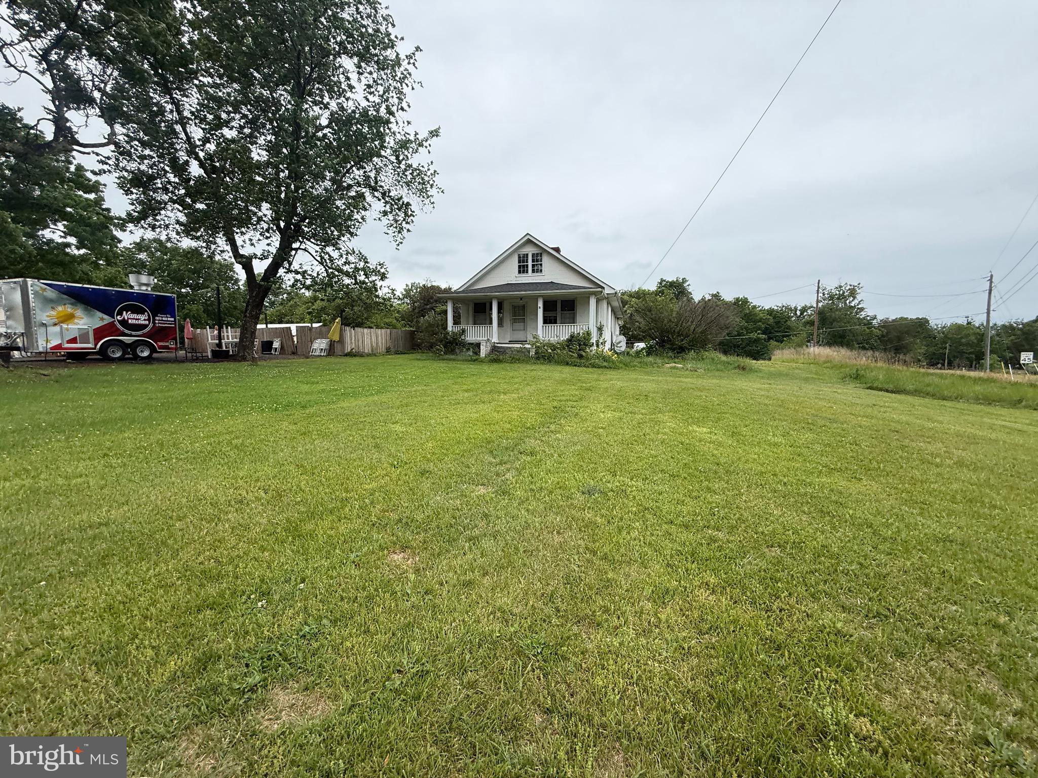 14074 Rixeyville Road Culpeper, VA 22701 - Photo 1 of 1 a front view of a house with a garden