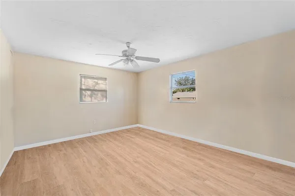 a view of empty room with windows