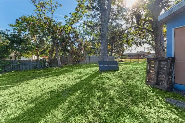 a backyard of a house with lots of green space