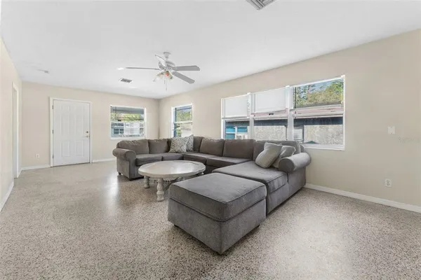 a living room with furniture and a large window