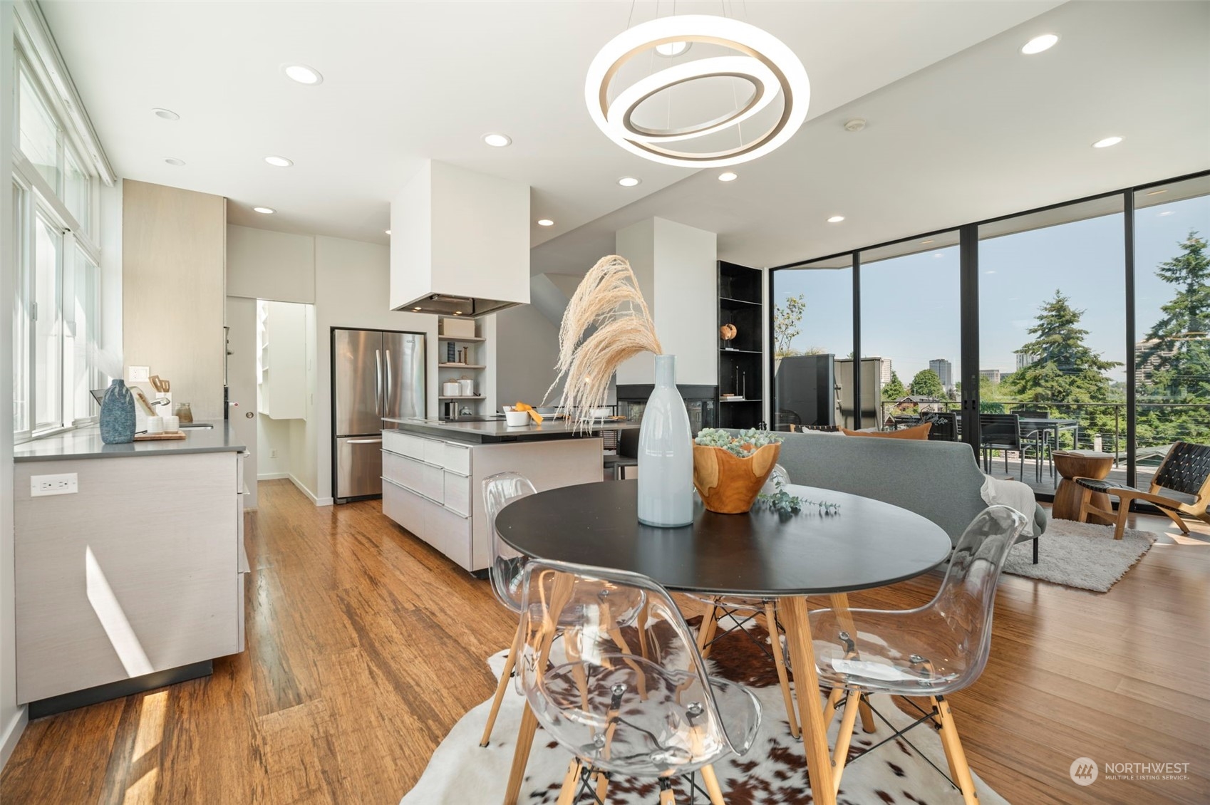 4322 Eastern Avenue North Seattle, WA 98103 - Photo 14 of 39 a kitchen with a table chairs stove and wooden floor