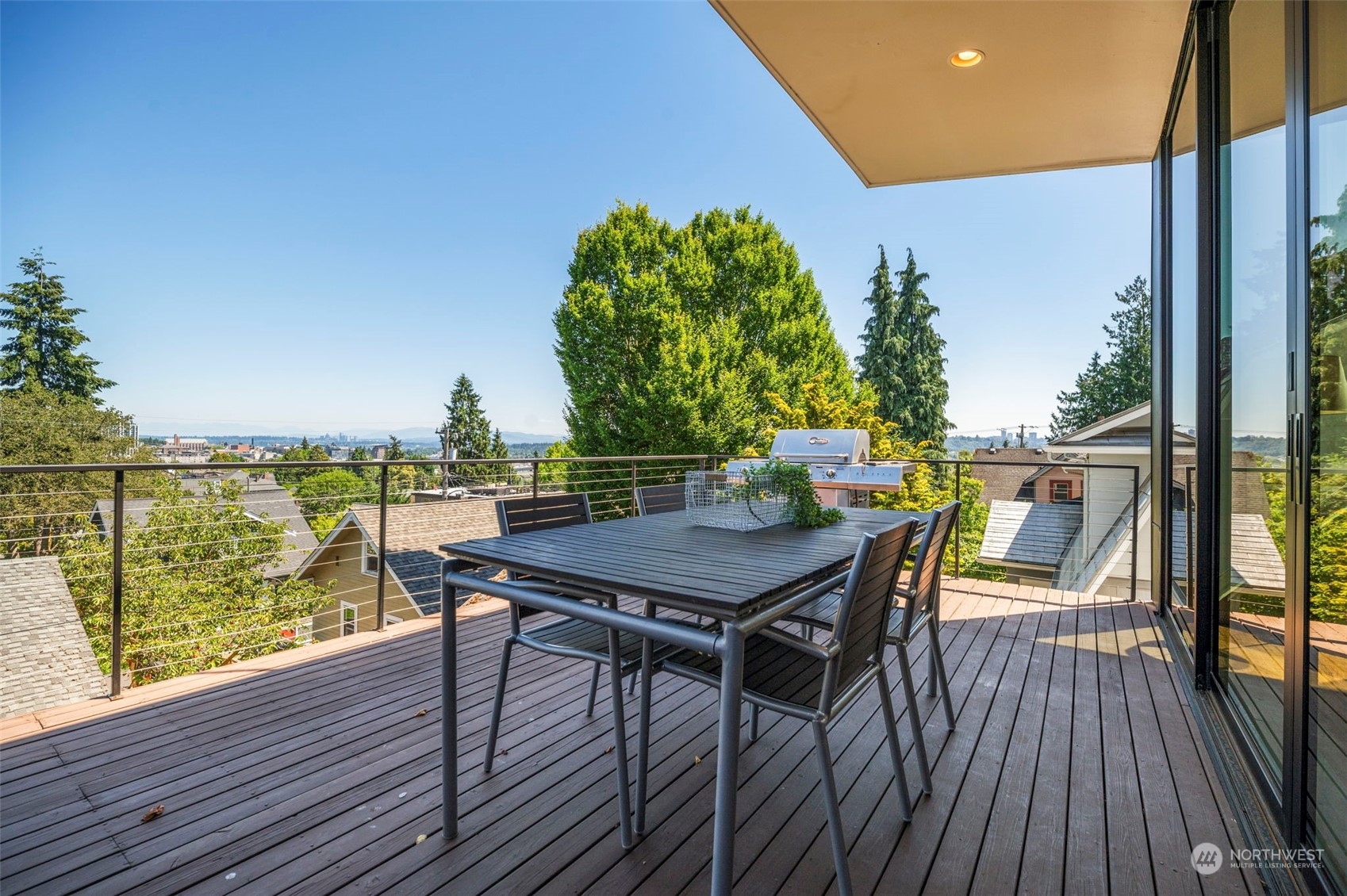 4322 Eastern Avenue North Seattle, WA 98103 - Photo 15 of 39 a view of a balcony with table and chairs and wooden floor