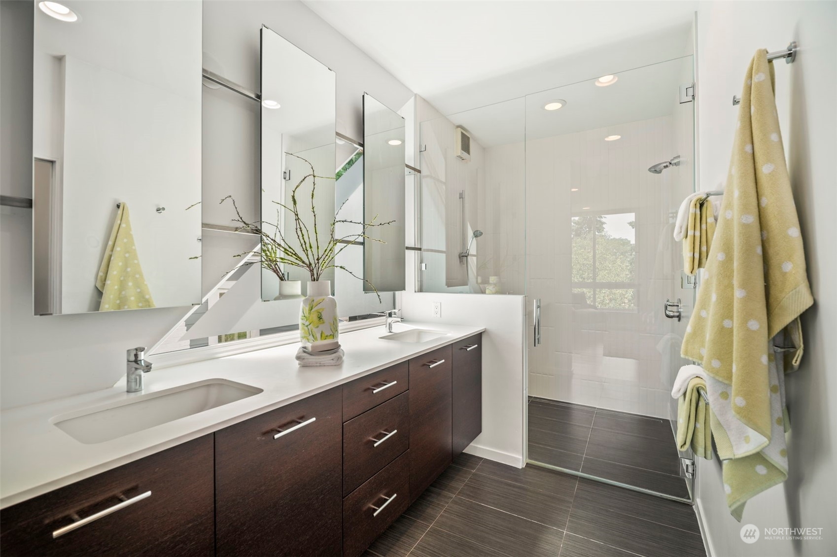 4322 Eastern Avenue North Seattle, WA 98103 - Photo 20 of 39 a bathroom with a double vanity sink a mirror and a shower