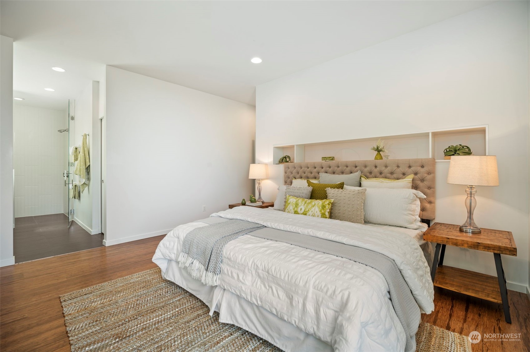 4322 Eastern Avenue North Seattle, WA 98103 - Photo 21 of 39 a bedroom with a bed and wooden floor