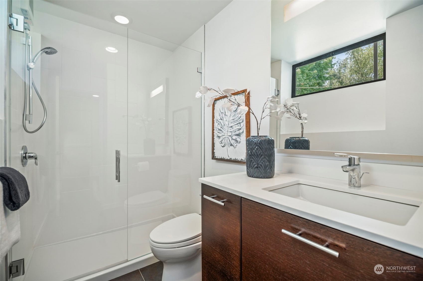 4322 Eastern Avenue North Seattle, WA 98103 - Photo 28 of 39 a bathroom with a sink a toilet and shower