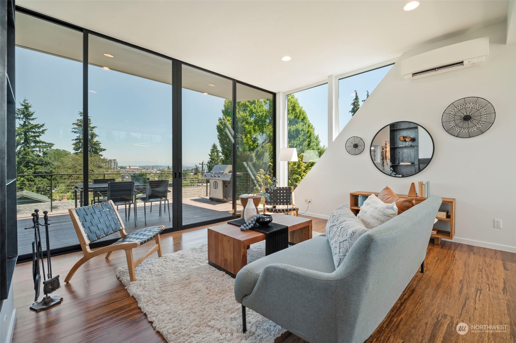 4322 Eastern Avenue North Seattle, WA 98103 - Photo 5 of 39 a living room with couches a coffee table and a chandelier