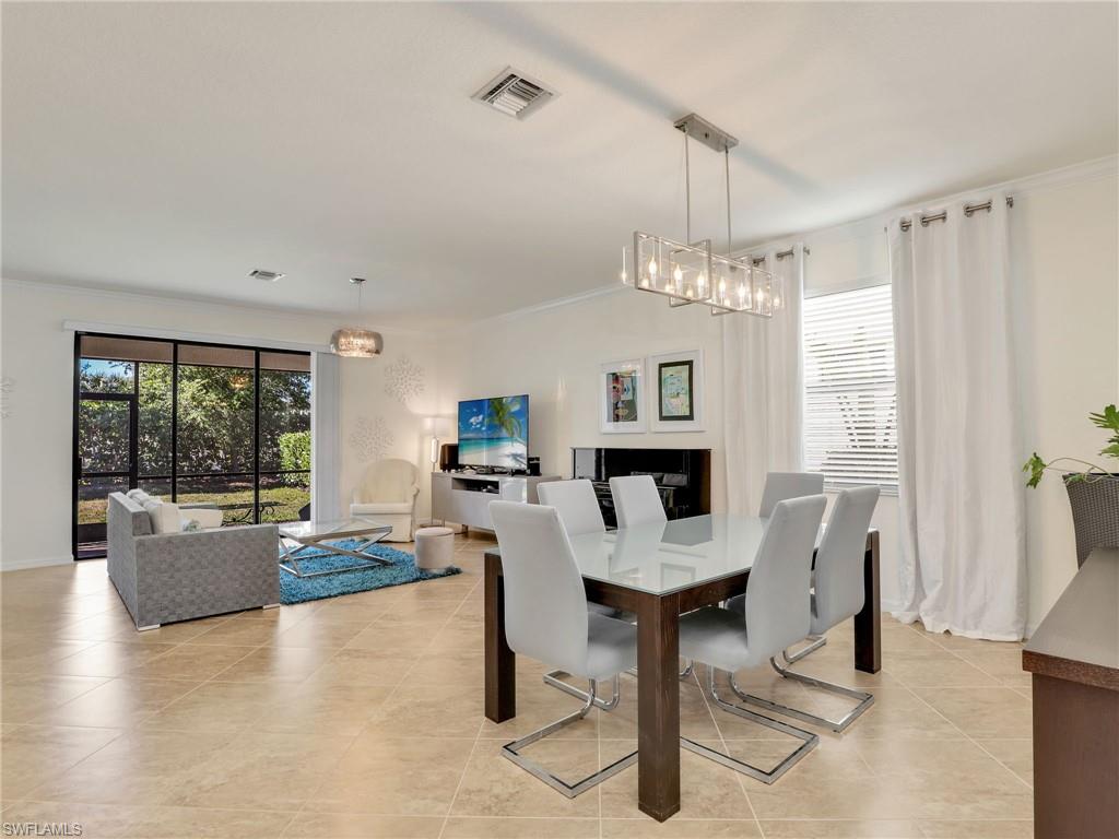 4212 Raffia Palm Circle Naples, FL 34119 - Photo 2 of 49 a view of a livingroom with furniture window and outside view