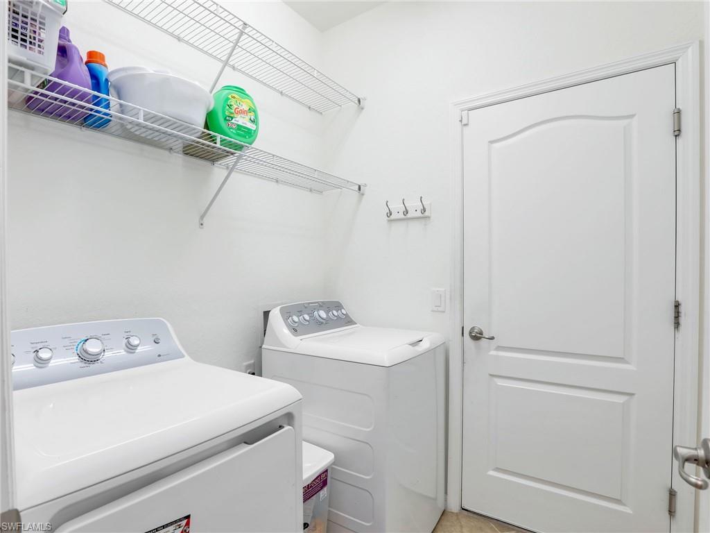 4212 Raffia Palm Circle Naples, FL 34119 - Photo 30 of 49 a utility room with dryer and washer