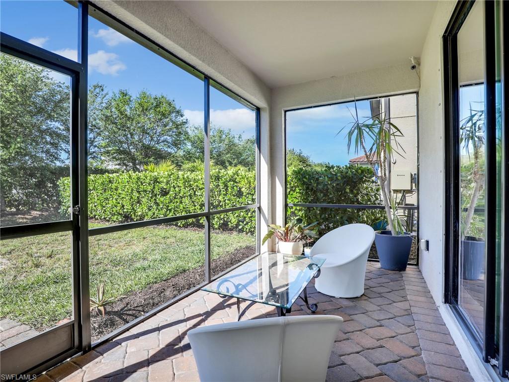 4212 Raffia Palm Circle Naples, FL 34119 - Photo 32 of 49 a view of a room with a furniture and balcony