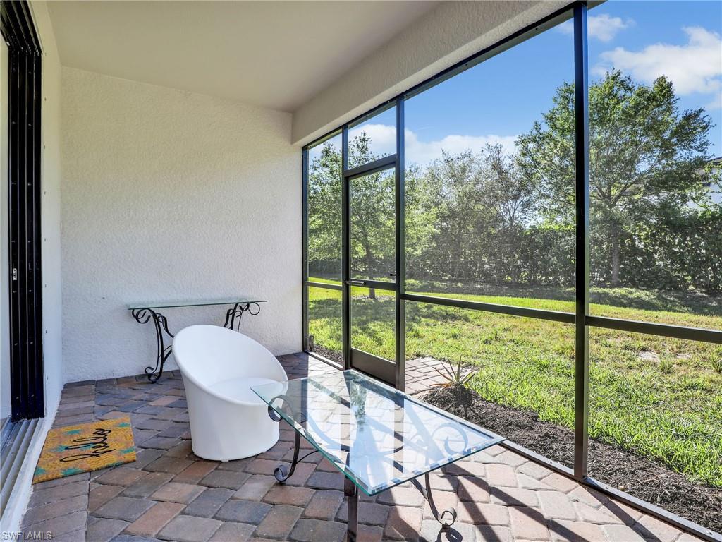 4212 Raffia Palm Circle Naples, FL 34119 - Photo 33 of 49 a view of a room with a large window