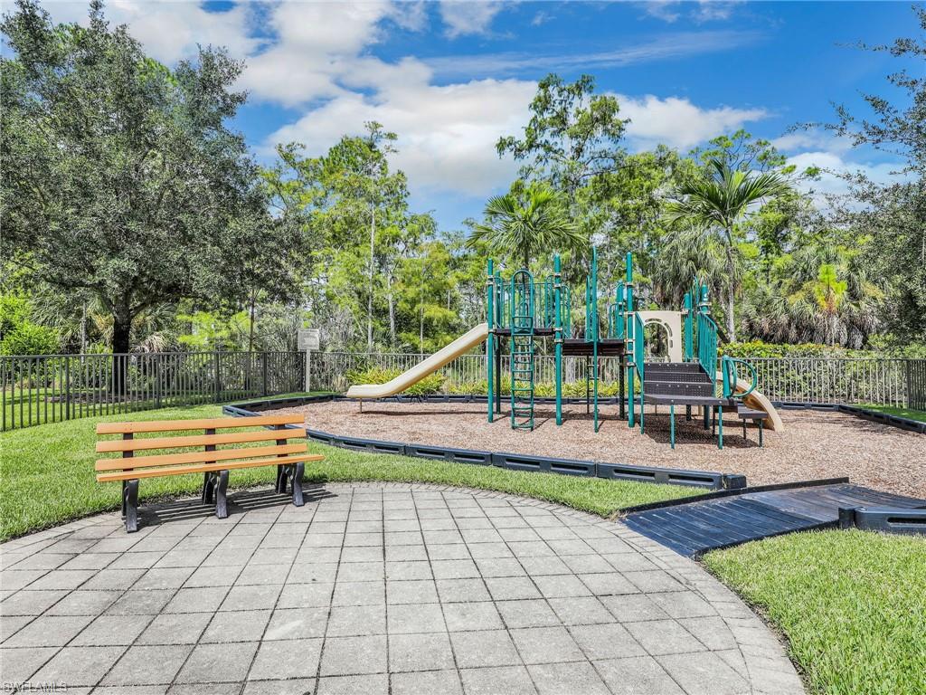 4212 Raffia Palm Circle Naples, FL 34119 - Photo 46 of 49 a view of a park with lounge chairs