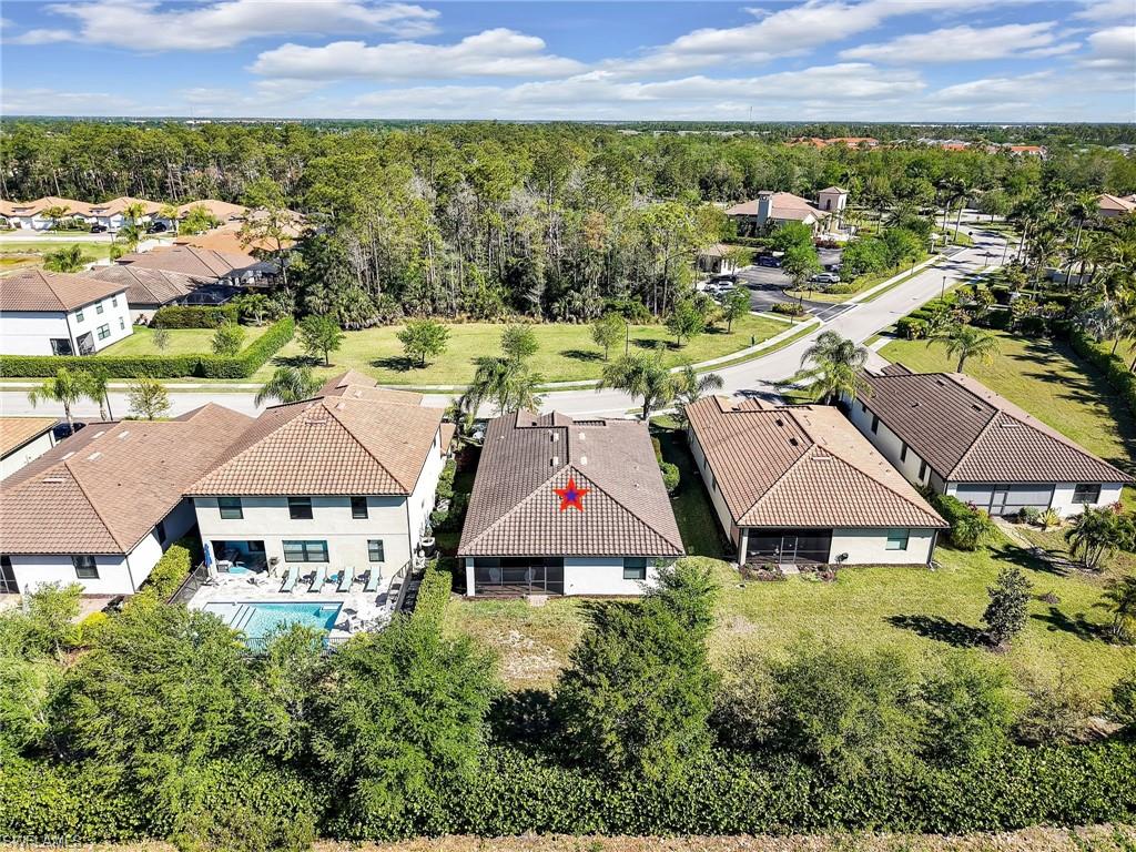 4212 Raffia Palm Circle Naples, FL 34119 - Photo 49 of 49 an aerial view of residential houses with outdoor space and trees