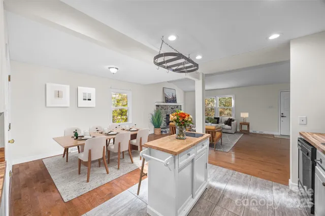 a living room with furniture a clock and a window