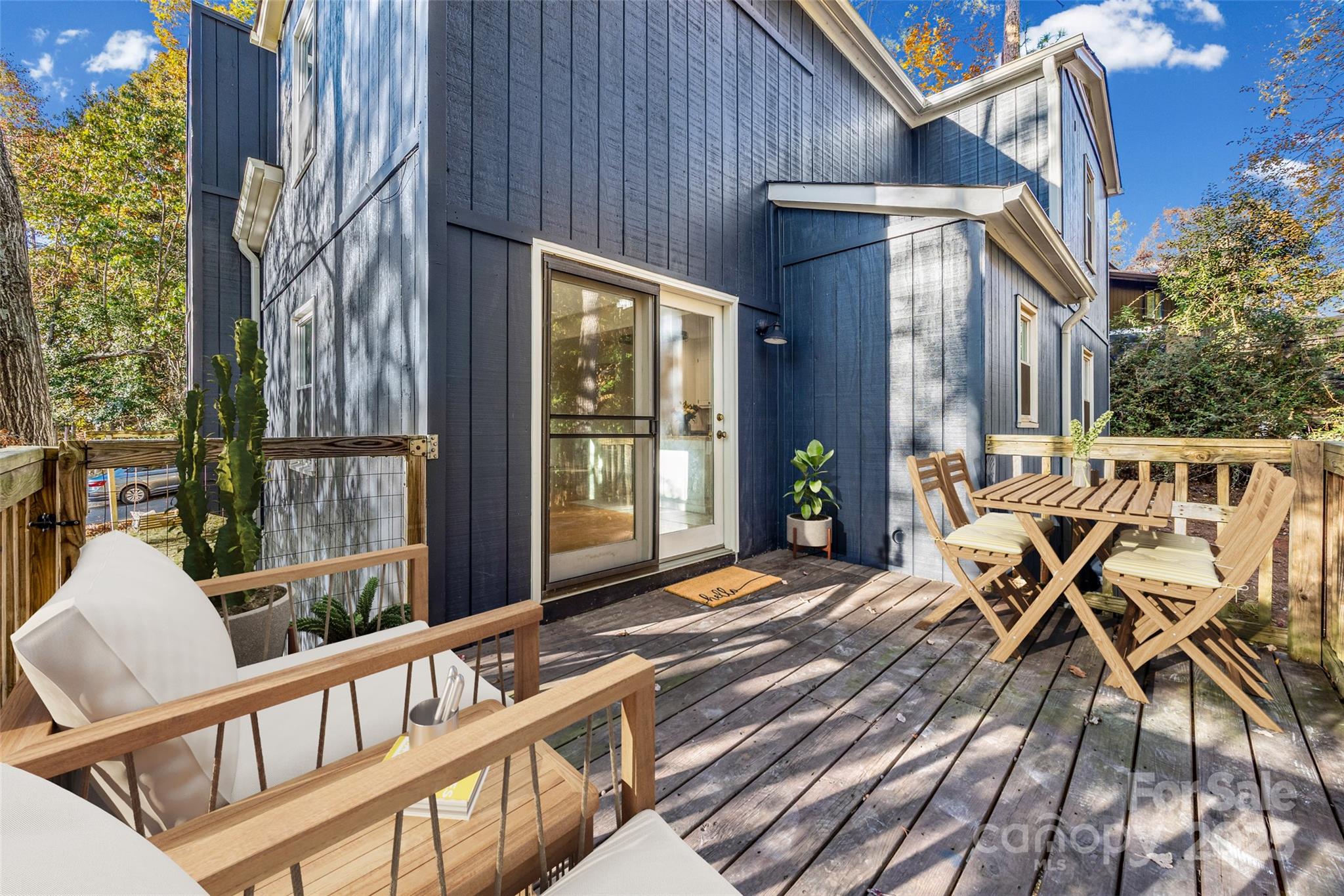 2137 Manawa Lane Tega Cay, SC 29708 - Photo 2 of 48 a porch with a table and chairs