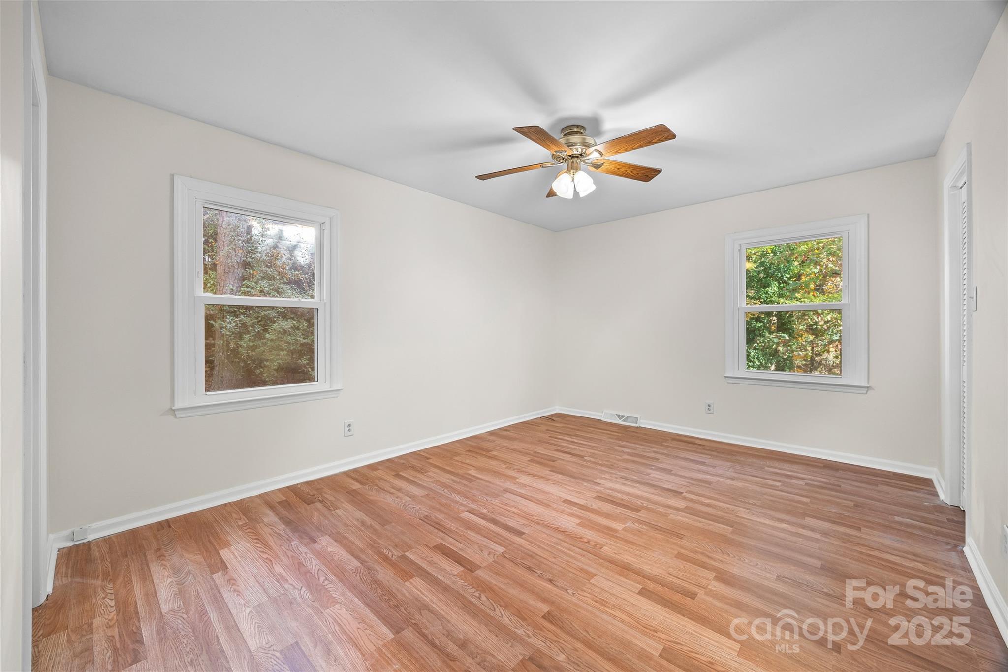 2137 Manawa Lane Tega Cay, SC 29708 - Photo 24 of 48 wooden floor in an empty room with a window