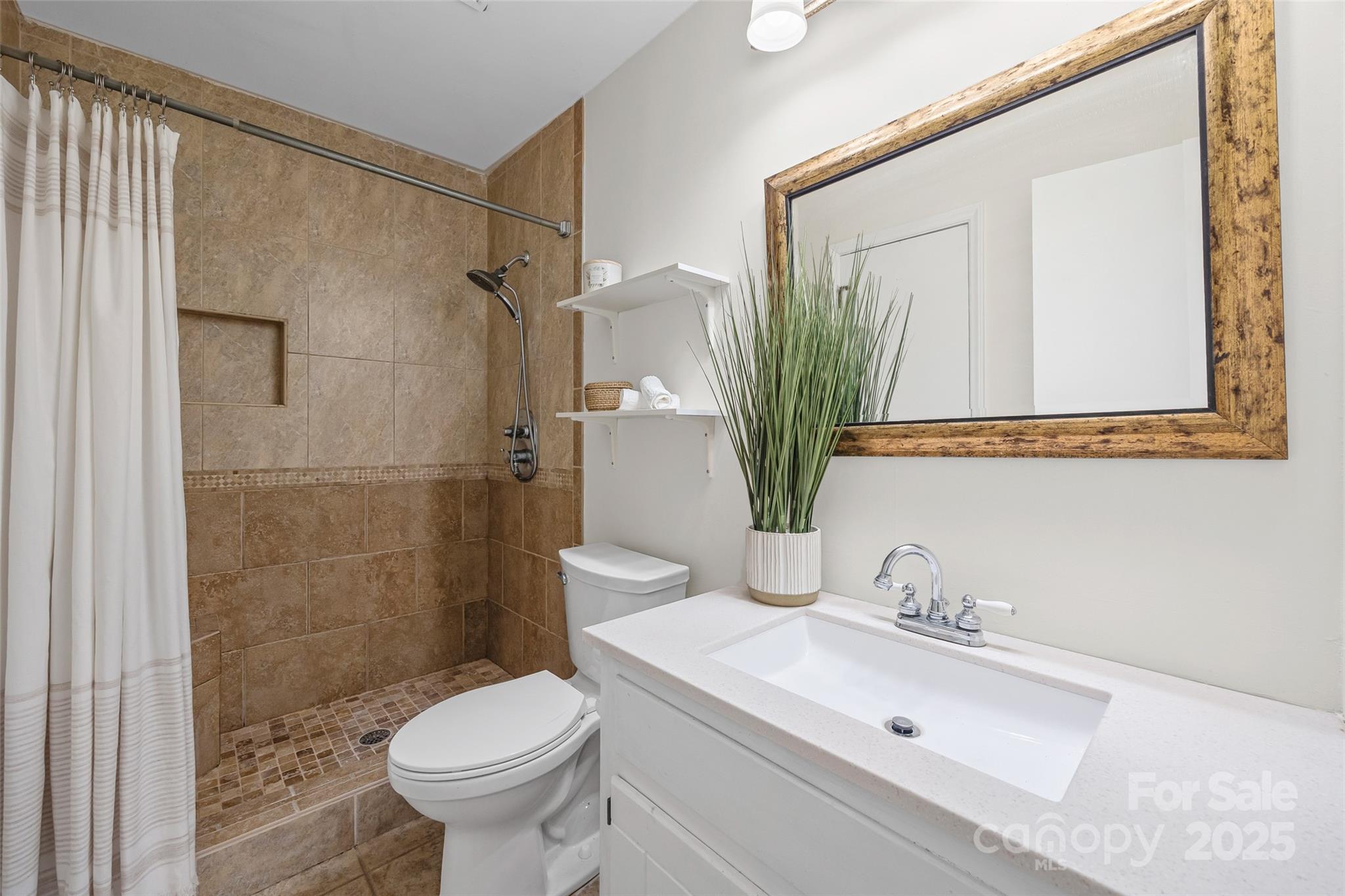 2137 Manawa Lane Tega Cay, SC 29708 - Photo 27 of 48 a bathroom with a sink toilet and shower