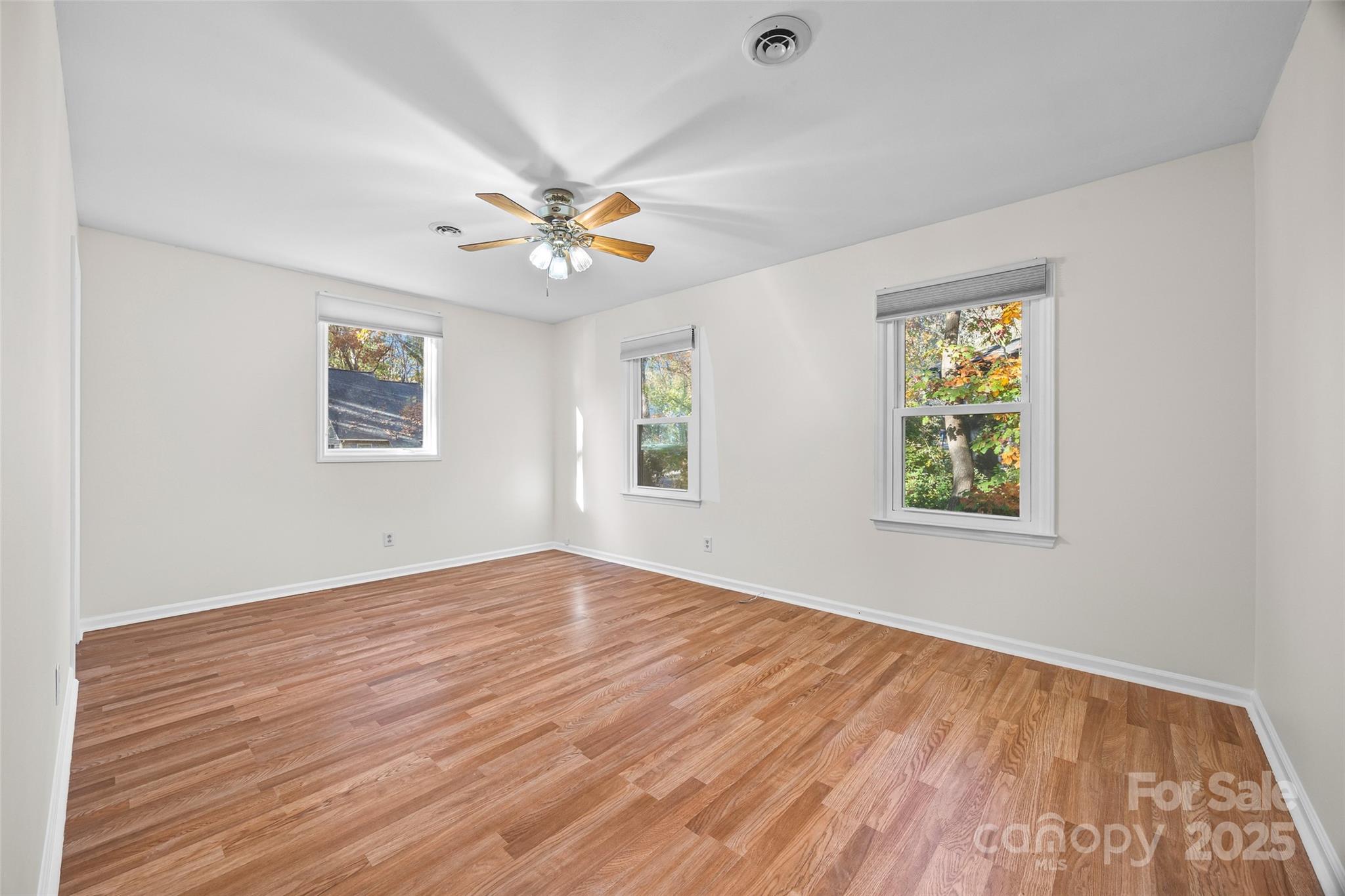 2137 Manawa Lane Tega Cay, SC 29708 - Photo 29 of 48 wooden floor in an empty room with a window