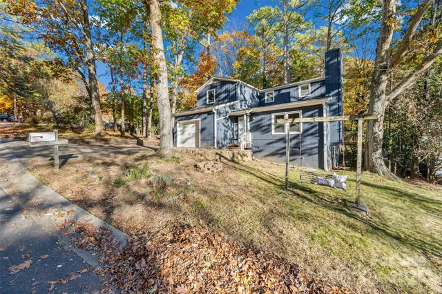 a large tree in the middle of a yard