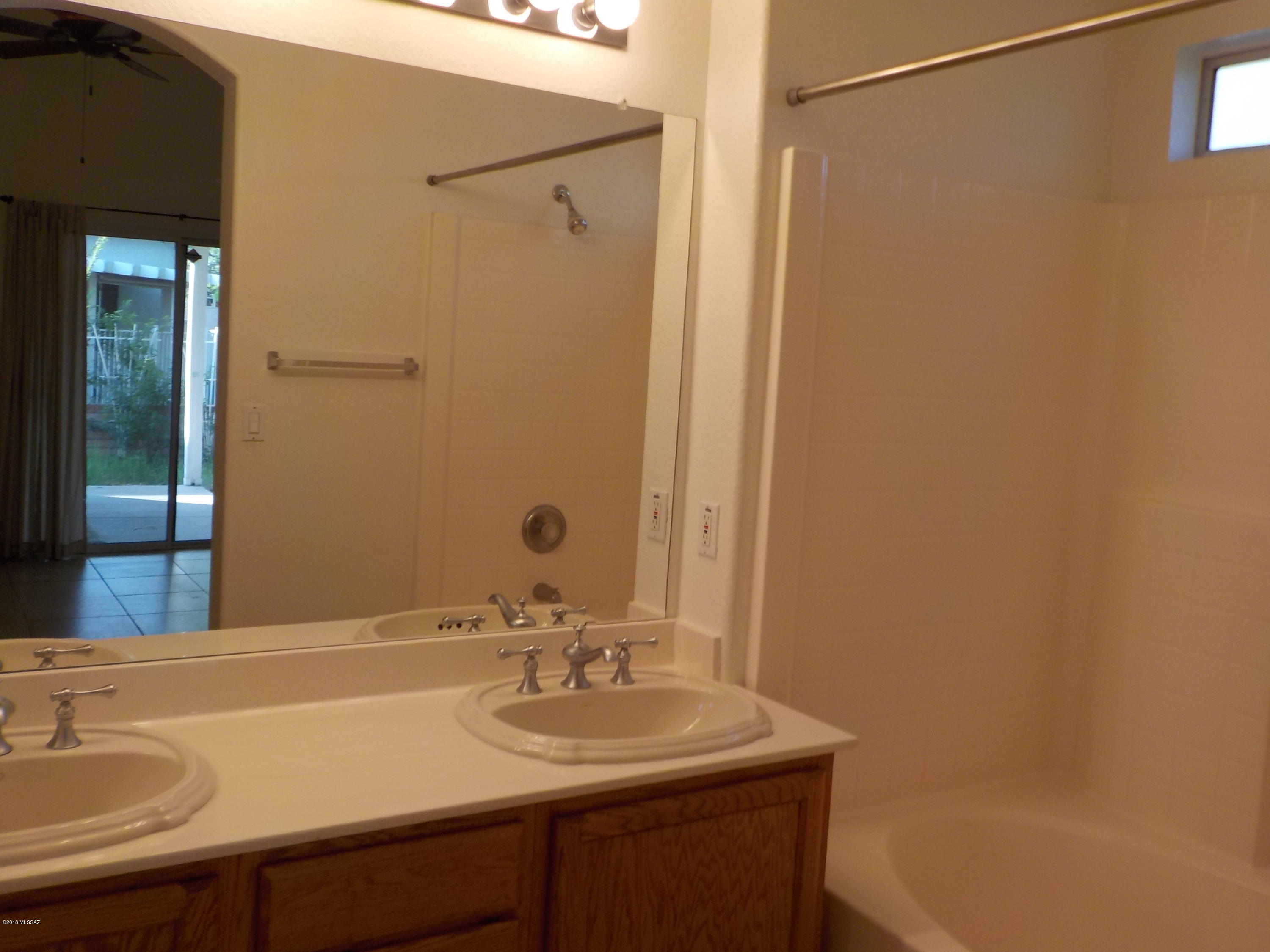 1153 Circulo Canario Rio Rico, AZ 85648 - Photo 9 of 16 a bathroom with a sink and a mirror