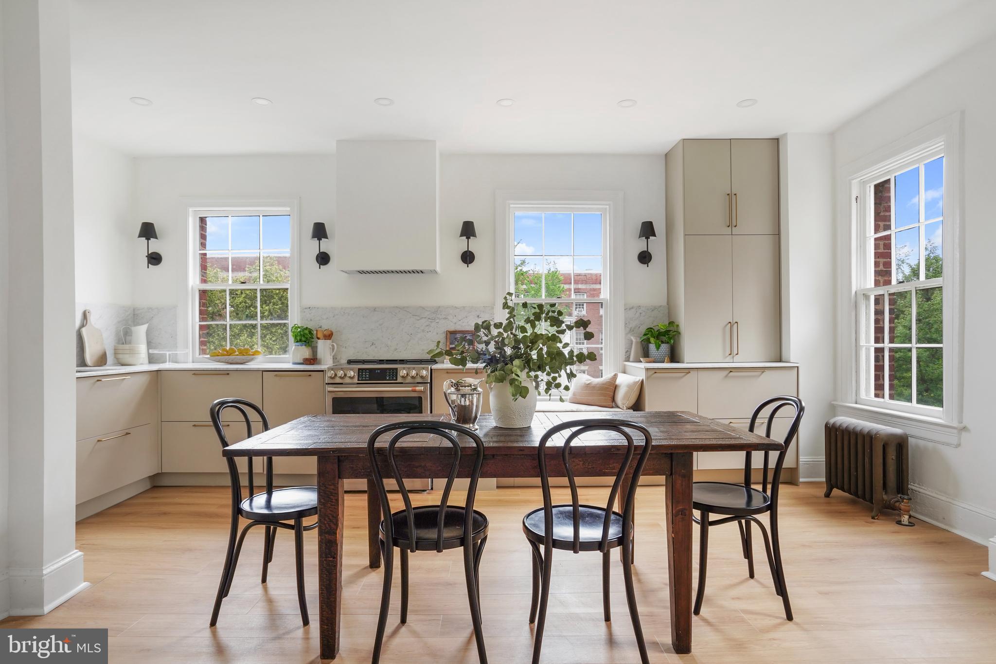 a view of a dining room with furniture and window