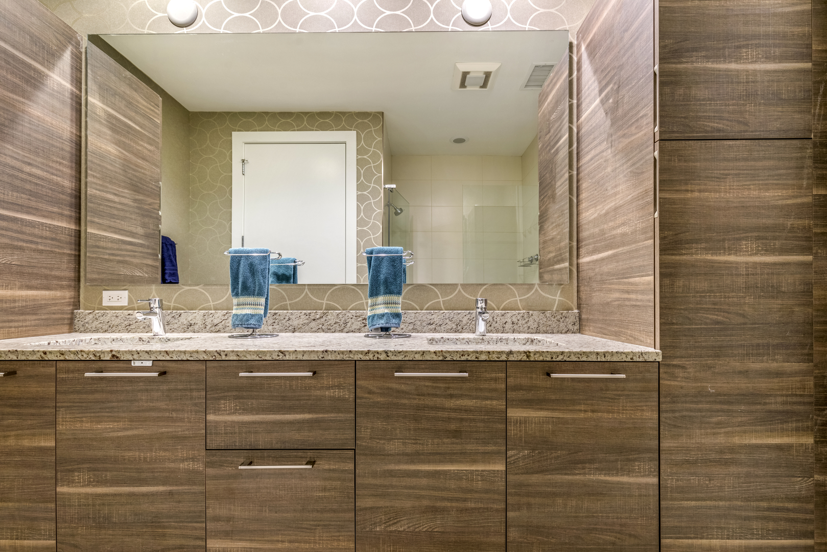 1120 West Adams Street, Unit PHW Chicago, IL 60607 - Photo 13 of 23 a bathroom with a granite countertop sink and a mirror