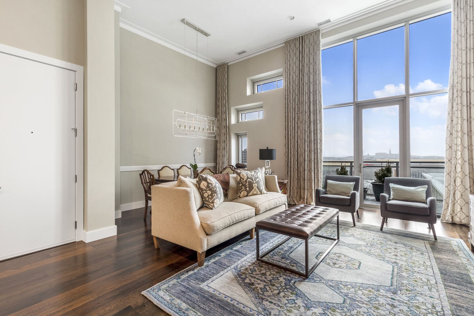1120 West Adams Street, Unit PHW Chicago, IL 60607 - Photo 3 of 23 a living room with furniture and a large window