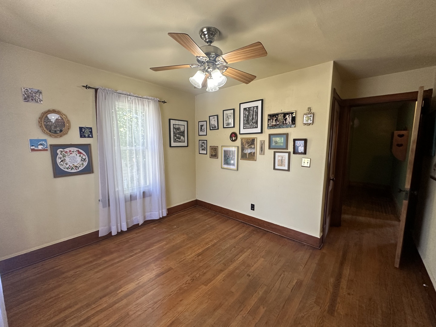 308 South Genesee Street Morrison, IL 61270 - Photo 17 of 24 an empty room with wooden floor and windows
