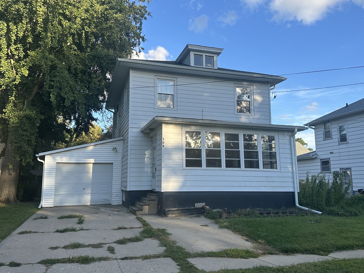 308 South Genesee Street Morrison, IL 61270 - Photo 2 of 24 a view of house with yard and plants in outdoor space