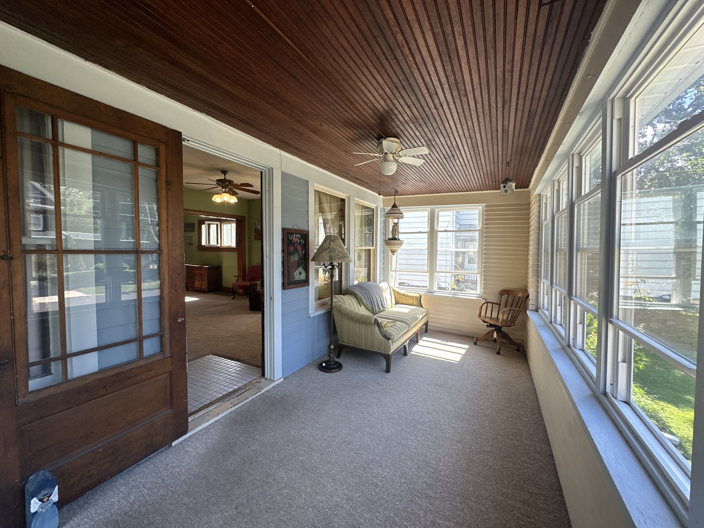308 South Genesee Street Morrison, IL 61270 - Photo 3 of 24 a living room with furniture and a floor to ceiling window