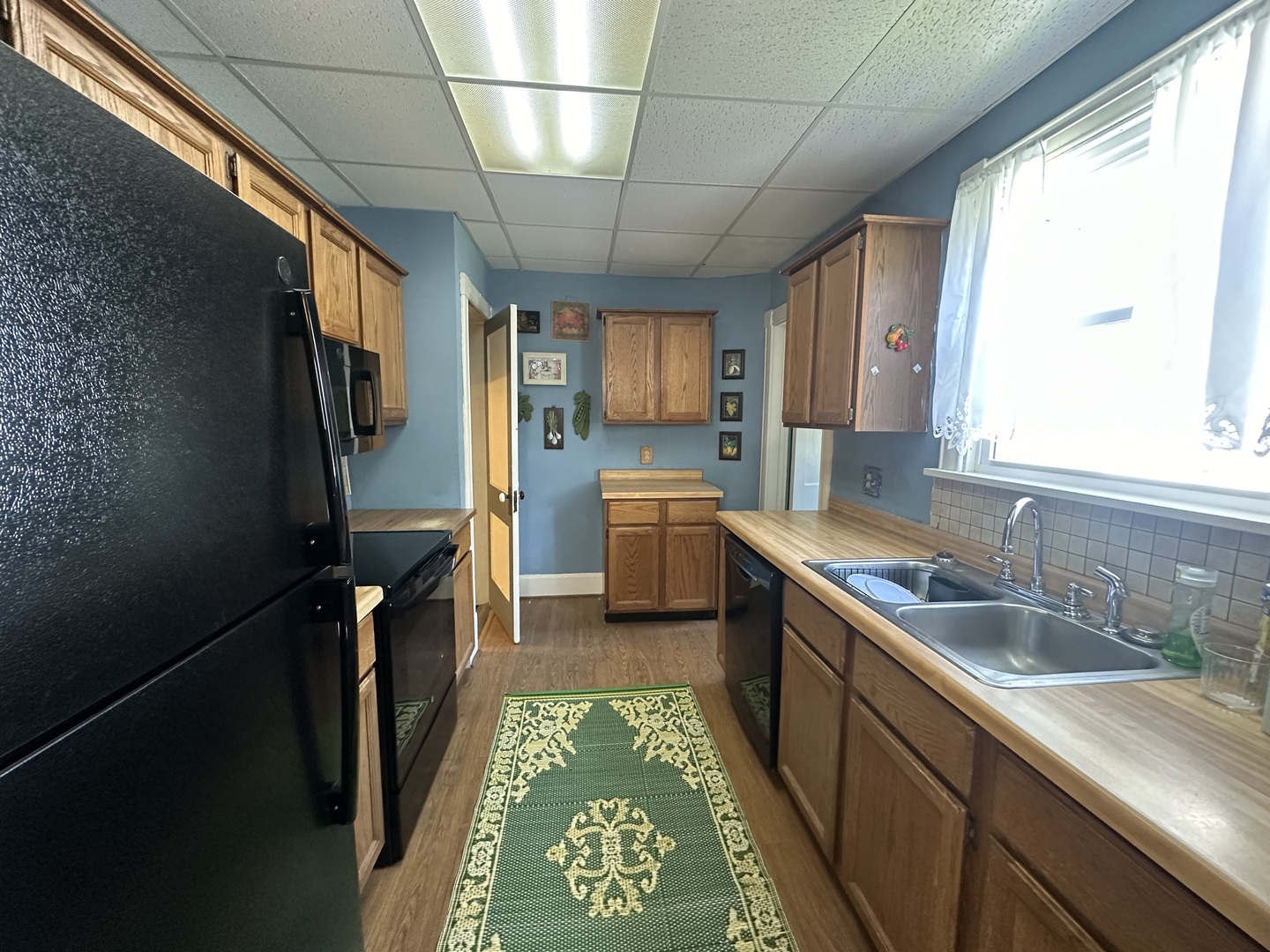 308 South Genesee Street Morrison, IL 61270 - Photo 9 of 24 a kitchen with sink cabinets and window