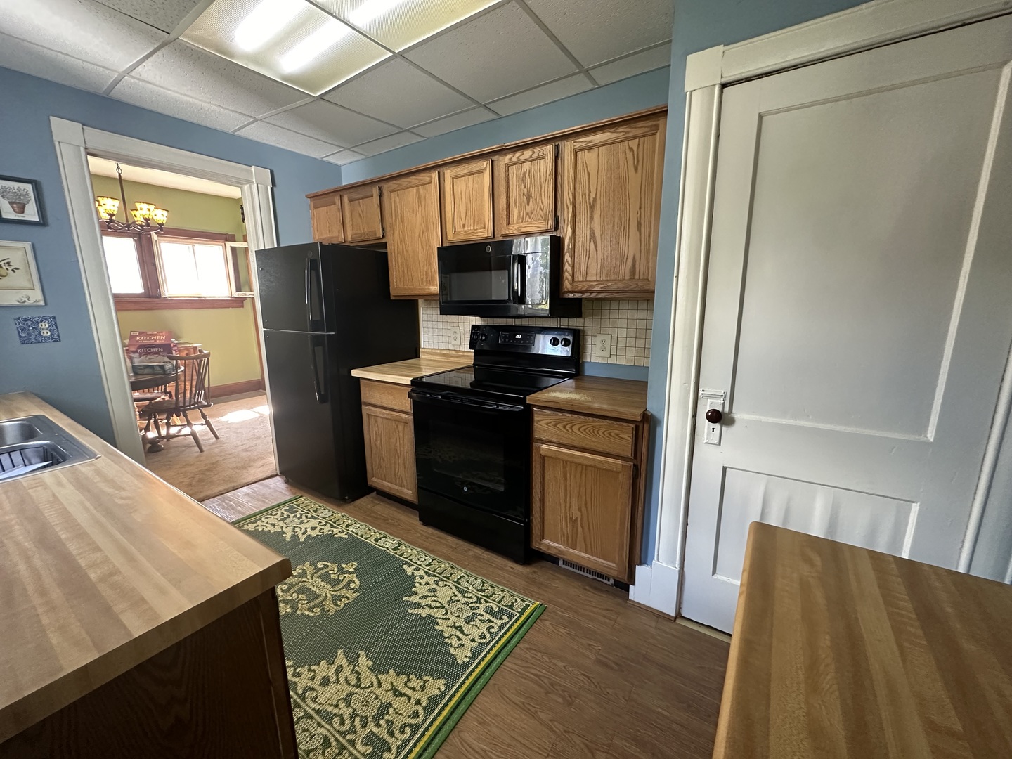 308 South Genesee Street Morrison, IL 61270 - Photo 10 of 24 a kitchen with stainless steel appliances granite countertop a refrigerator and a stove